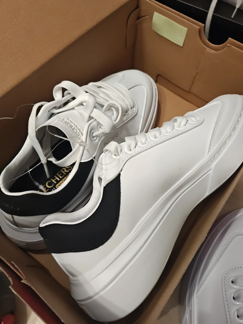Skechers Men’s White Sneakers with Black Heel Accent 9